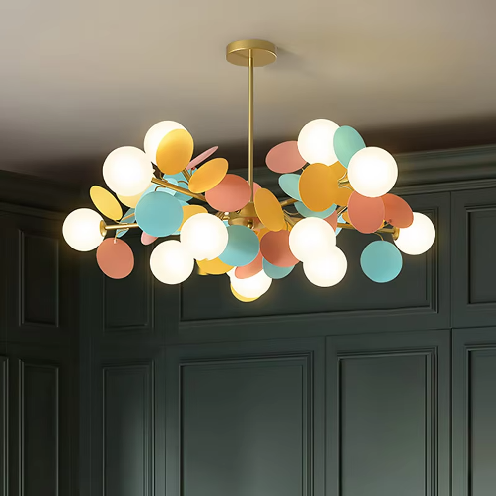This playful and colorful linear disc chandelier features a gold metal frame, paired with milky white glowing spheres and macaron-colored (pink, orange, blue, yellow) decorative discs arranged in a fluffy cloud-like layout. When lit, it emits a soft and warm glow, creating a lively and comforting atmosphere. Ideal for kids' bedrooms, parent-child play areas, dining rooms, and other spaces, it adds a dreamy and romantic touch to childlike or modern minimalist environments.