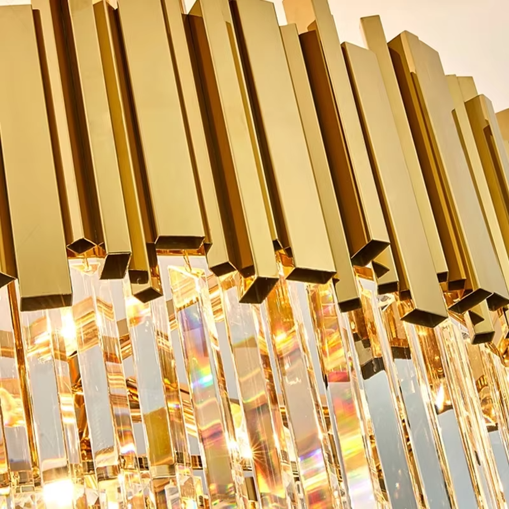 This modern light luxury two-layer linear chandelier features an upper frame enclosed by gold metal strips, with transparent crystal tassels hanging below, suspended by gold chains. When lit, light refracts through the crystal to emit a brilliant and luxurious glow, combining a luxurious texture with an ambient atmosphere. Ideal for dining rooms, bars, light luxury apartments, and other spaces, it adds an exquisite and sophisticated touch to modern minimalist or light luxury home environments.