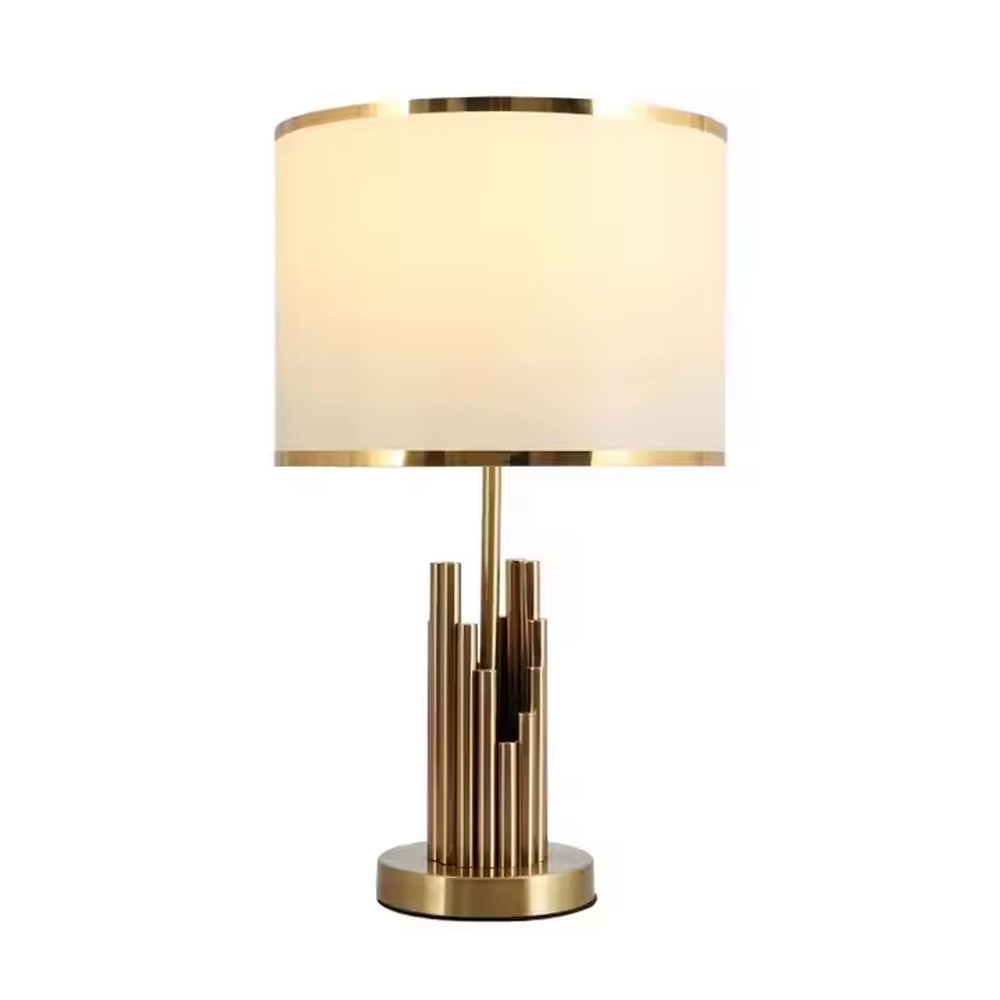 This is a modern luxury-style table lamp with a golden metal multi-column base and a beige fabric lampshade, featuring a simple and elegant design. It is used for local desktop lighting and decoration, combining practicality and aesthetics. It is suitable for modern home bedroom bedside tables, living room side tables, high-end hotel guest rooms, luxury apartment living spaces and other places.