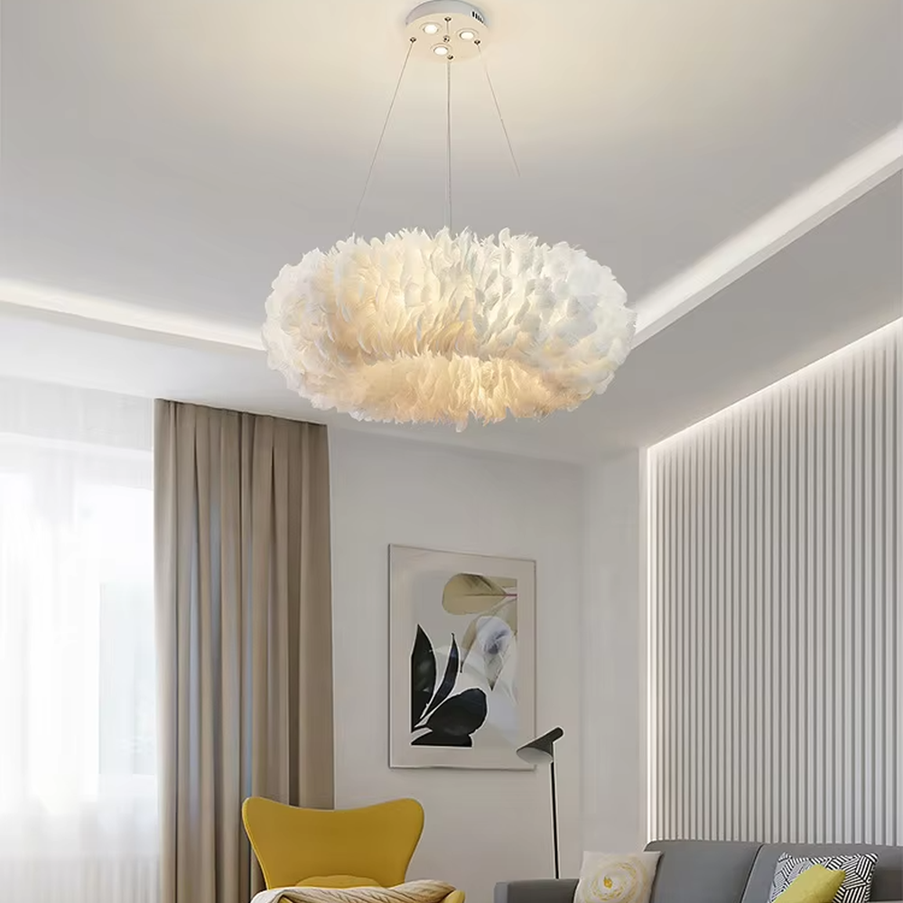 Nordic-style cloud feather chandelier, featuring a fluffy cloud-shaped lampshade made of natural white feathers. It emits soft and gentle light, combining a romantic ambiance and a soothing feel, making it a decorative lighting fixture that enhances the warmth of the space.