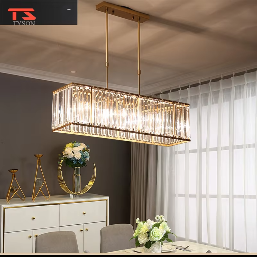 This modern light luxury linear crystal chandelier features a black metal frame, inlaid with transparent long crystals to form a rectangular shape, paired with height-adjustable black suspension wires. When lit, light refracts through the crystal to emit a brilliant and luxurious glow, combining a bold texture with an elegant ambiance. Ideal for dining rooms, bars, light luxury apartments, and other spaces, it adds an exquisite and sophisticated touch to modern minimalist or industrial-style home environments.