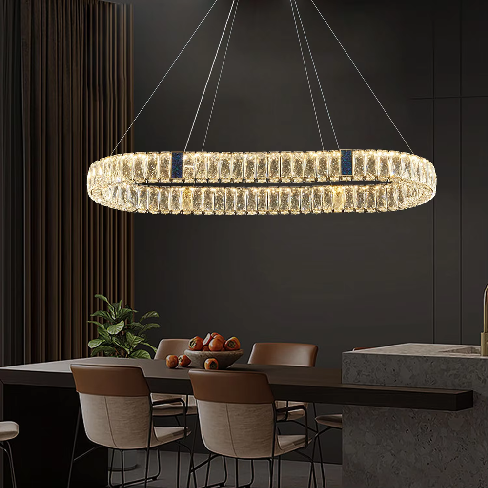 This light luxury and grand multi-layer conical crystal chandelier features a gold metal frame, with vertical-textured glass lampshades on the upper layer and multiple layers of transparent crystal tassels hanging below, creating a full conical shape. When lit, light refracts through the crystal to emit a brilliant and luxurious glow, combining elegant texture with an ambient atmosphere. Ideal for living rooms, dining rooms, villa high-ceiling spaces, and other areas, it adds an elegant and exquisite touch to European light luxury or modern luxury home environments.