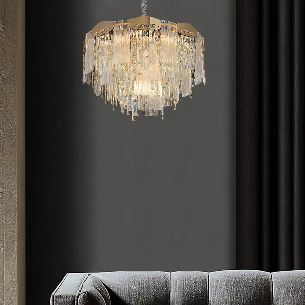 This modern light luxury linear crystal chandelier features a gold metal frame, with dense transparent long crystals hanging down and hollow-textured metal decorative blocks on top. When lit, light refracts through the crystal to emit a brilliant and soft glow, combining an exquisite texture with an ambient atmosphere. Ideal for dining rooms, bars, light luxury apartments, and other spaces, it adds an exquisite and sophisticated touch to modern minimalist or light luxury home environments.