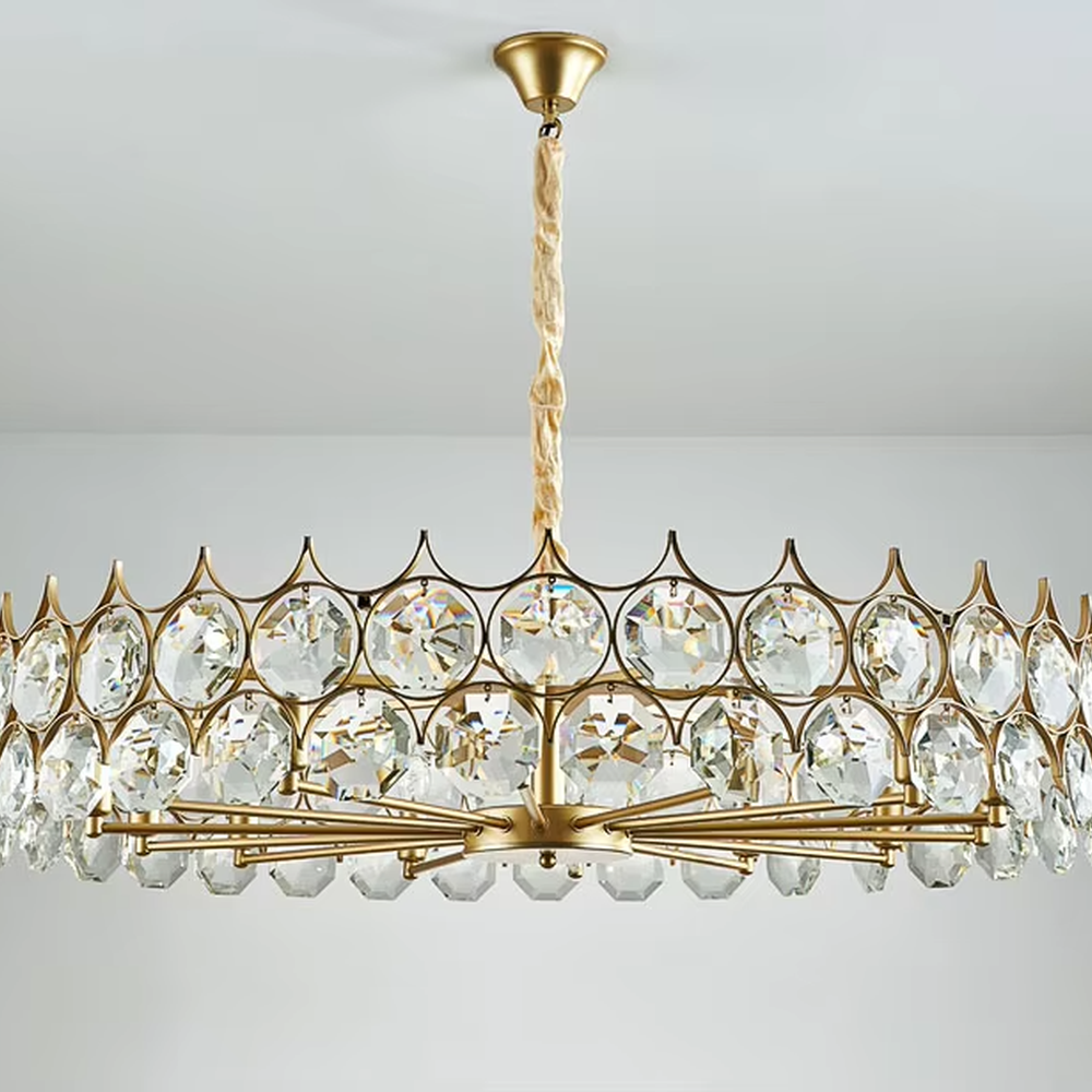 This modern light luxury linear crystal chandelier features a gold metal frame, inlaid with two layers of round-cut crystal slices, suspended by a braided cord. When lit, light refracts through the crystal to emit a brilliant and soft glow, combining a retro-exquisite texture with an ambient atmosphere. Ideal for dining rooms, bars, light luxury apartments, and other spaces, it adds an exquisite and sophisticated touch to modern minimalist or French light luxury home environments.