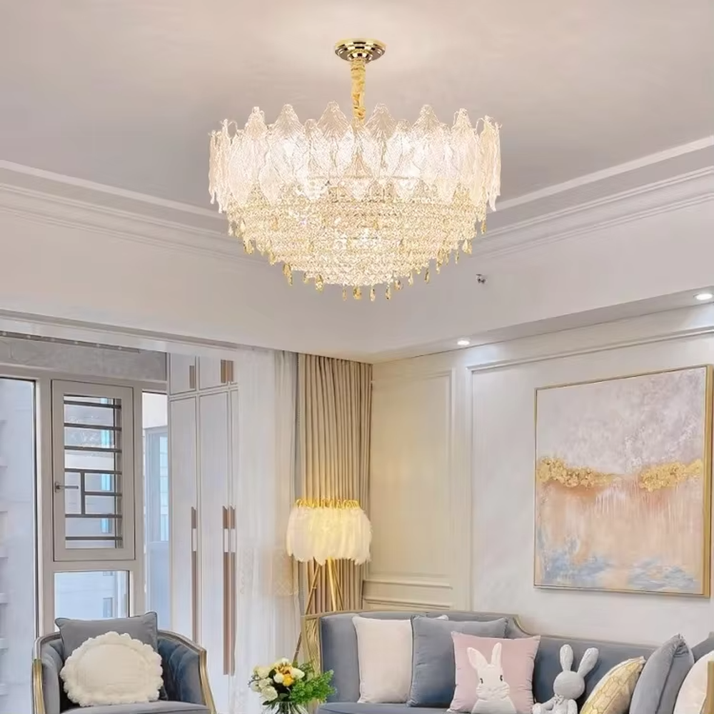 This modern light luxury two-layer flower crown chandelier features an upper lampshade of transparent leaf-textured glass and a lower layer of dense crystal tassels, forming a full flower crown shape. When lit, light refracts through the crystal and glass to emit a brilliant and soft glow, combining an ethereal texture with an ambient atmosphere. Ideal for living rooms, dining rooms, light luxury apartments, and other spaces, it adds a dreamy and exquisite touch to modern minimalist or French light luxury home environments.