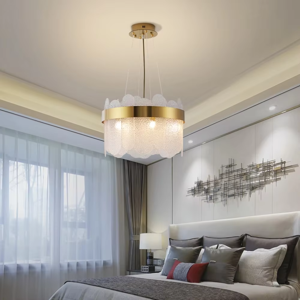 Modern light luxury smoky gray glass chandelier, featuring a ring frame in gold metal paired with layered smoky gray curved glass panels. Light refracts through the glass to create a soft and translucent glow, combining sophistication and ambiance, making it a decorative lighting fixture that elevates the space's style.
