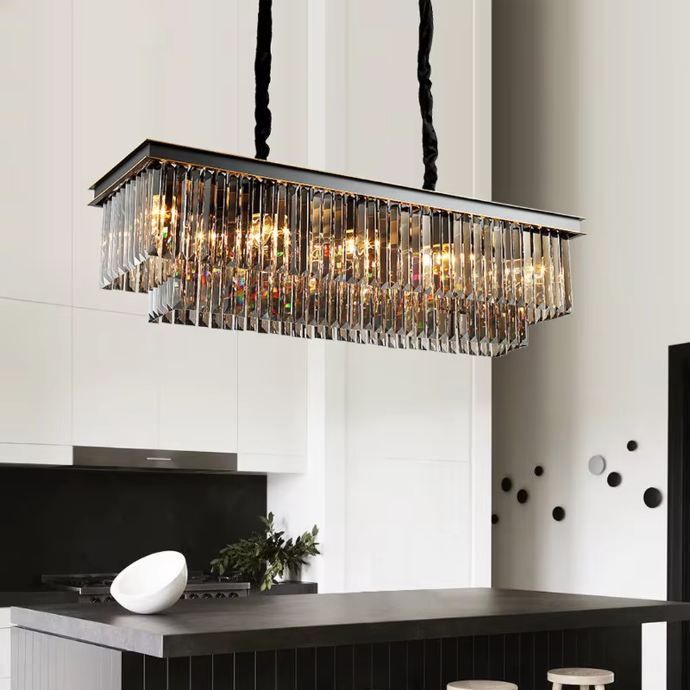 This modern light luxury circular crystal chandelier features a black metal frame, with dense transparent long crystals hanging down to form a full circular shape, suspended by a braided cord. When lit, light refracts through the crystal to emit a brilliant and soft glow, combining a bold texture with an ambient atmosphere. Ideal for living rooms, dining rooms, light luxury apartments, and other spaces, it adds an exquisite and sophisticated touch to modern minimalist or light luxury home environments.