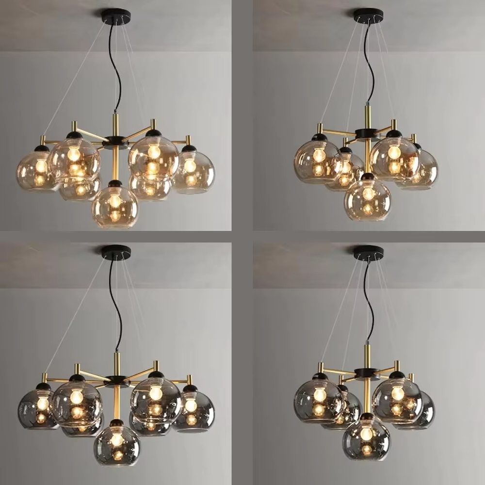 Modern light luxury black and gold branch chandelier, featuring a radial frame in black and gold metal paired with gradient smoky gray glass ball lampshades. Its sophisticated and layered design combines style and ambiance, making it a high-end decorative lighting fixture that elevates the space's aesthetic.