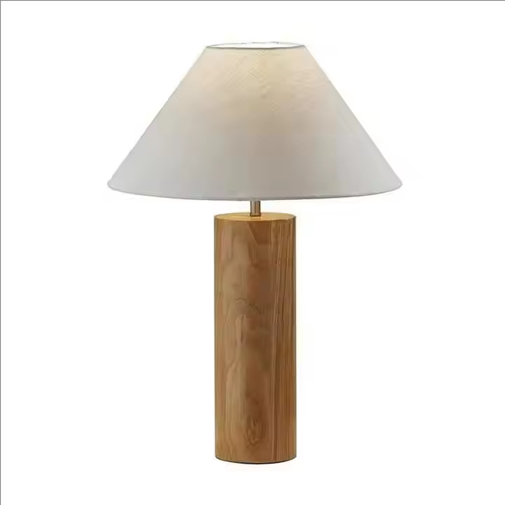 This is a natural minimalist wooden table lamp with a cylindrical solid wood base and a white fabric slant lampshade. It features a rustic and natural design with a warm ambiance. It is used for local desktop lighting and decoration, creating a natural and warm atmosphere. It is suitable for Nordic-style home bedrooms, Japanese art homestays, literary cafes and other places.