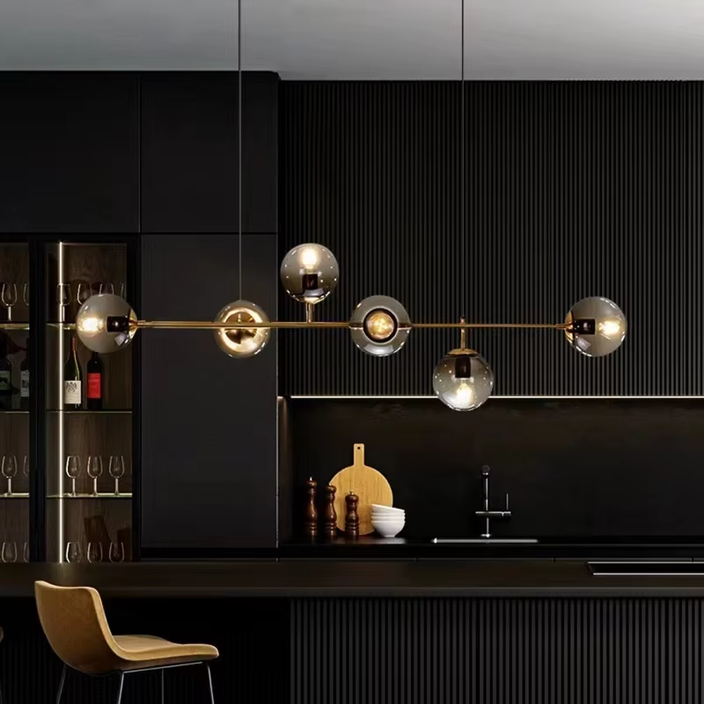 Modern light luxury molecular structure chandelier, featuring a linear brass metal frame paired with gradient smoky gray glass ball lampshades. Its minimalist and layered design combines style and ambiance, making it a decorative lighting fixture that elevates the space's aesthetic.
