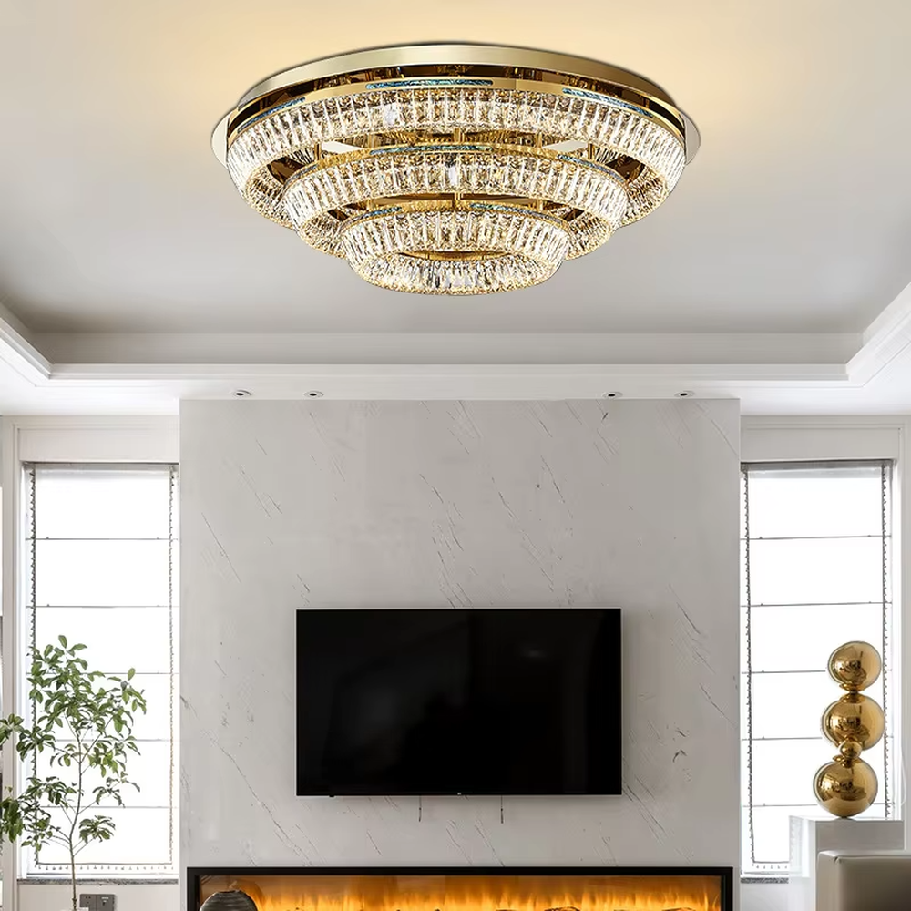 This modern light luxury rectangular two-layer crystal chandelier features a gold metal frame, inlaid with transparent long crystals to form a double-layered rectangular shape. When lit, light refracts through the crystal to emit a brilliant and soft glow, combining an exquisite texture with an ambient atmosphere. Ideal for dining rooms, bars, and above dining tables in light luxury apartments, it adds an exquisite and sophisticated touch to modern minimalist or light luxury spaces.