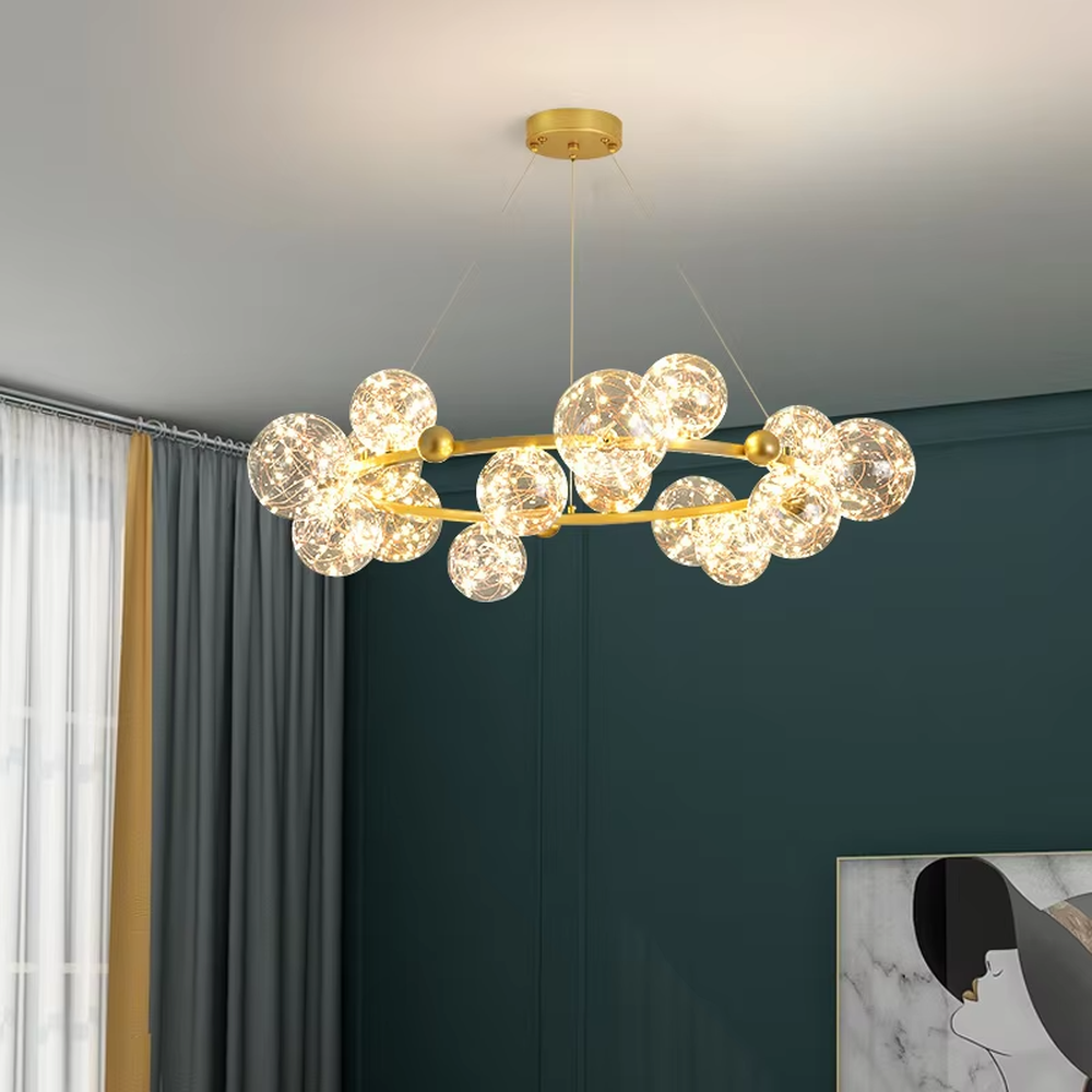 Modern light luxury starry sky ring chandelier, featuring a brass metal ring frame paired with transparent bubble glass balls with built-in lamp beads to form a star cluster shape. It emits bright and translucent light, combining a dreamy feel and elegant ambiance, making it a high-end decorative lighting fixture that elevates the space's style.
