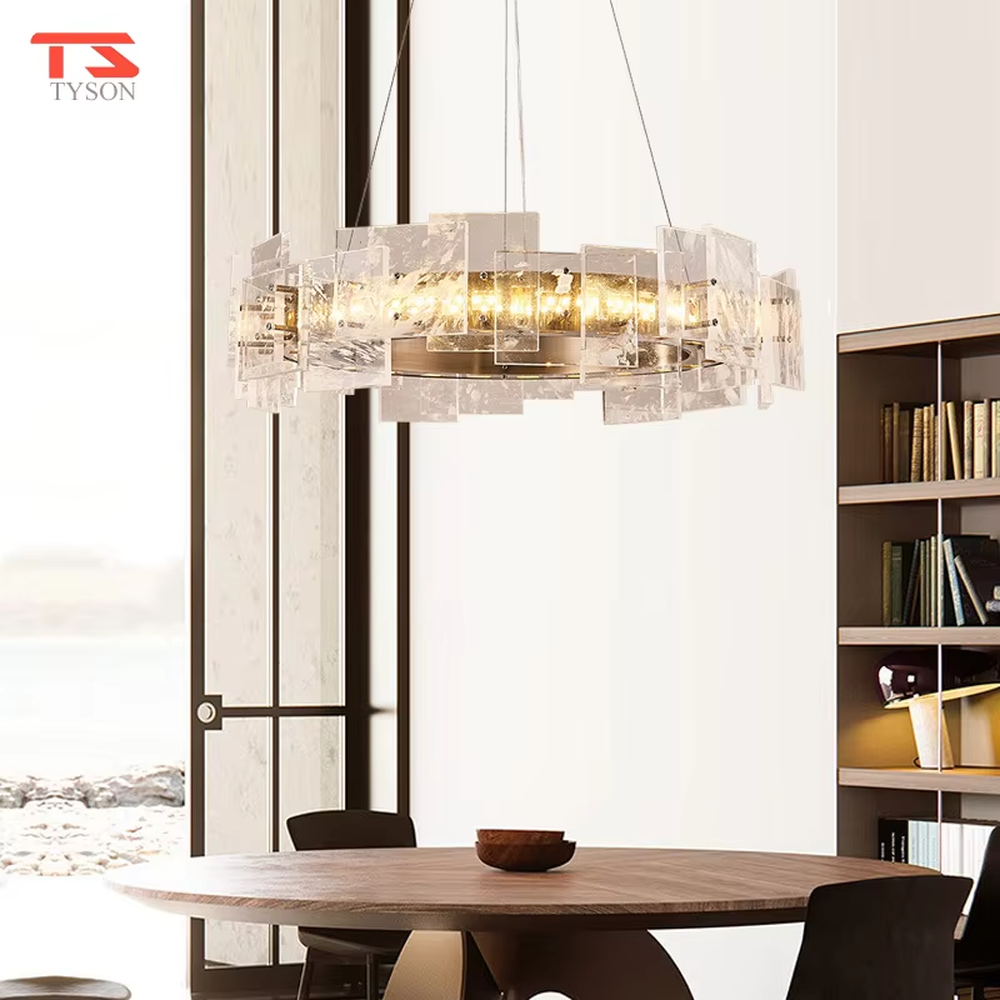 Modern light luxury ice crystal ring chandelier, featuring a gold metal frame paired with staggered ice-crystal textured acrylic panels. Light refracts through the panels to create a brilliant and soft glow, combining luxury texture and artistic ambiance, making it a high-end decorative lighting fixture that elevates the space's style.