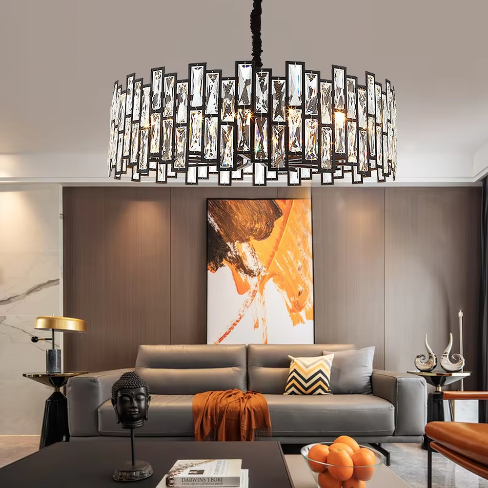 This modern light luxury square crystal chandelier features a black metal frame, inlaid with multi-faceted cut crystal pieces to form a square shape. When lit, light refracts through the crystal to emit a brilliant and luxurious glow, combining a bold texture with an elegant ambiance. Ideal for living rooms, dining rooms, large apartments, and other spaces, it adds an exquisite and sophisticated touch to modern minimalist or light luxury home environments.