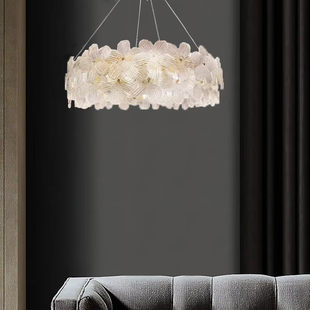 This modern light luxury linear petal chandelier features a full linear shape made of transparent petal-shaped glass slices. When lit, light refracts through the glass to emit a soft and brilliant glow, combining an ethereal texture with an ambient atmosphere. Ideal for dining rooms, bars, light luxury apartments, and other spaces, it adds a dreamy and exquisite touch to modern minimalist or French light luxury home environments.