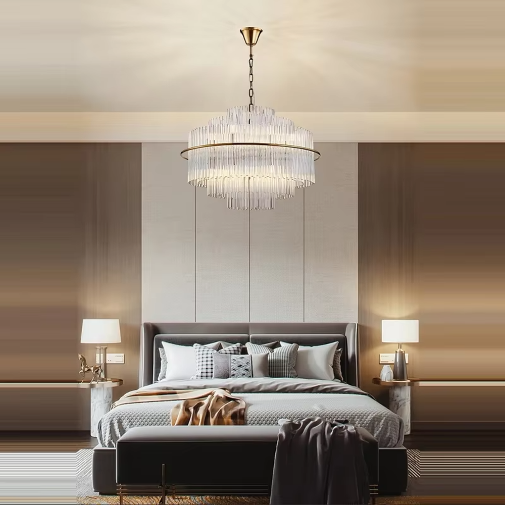 This modern light luxury multi-layer circular crystal chandelier features a gold metal frame, with multiple tiers of transparent long crystals hanging down to form a full circular shape, suspended by a gold chain. When lit, light refracts through the crystal to emit a brilliant and soft glow, combining a luxurious texture with an ambient atmosphere. Ideal for bedrooms, living rooms, light luxury apartments, and other spaces, it adds an exquisite and sophisticated touch to modern minimalist or light luxury home environments.