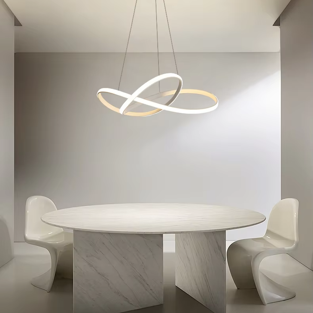 Modern light luxury interlocking double-ring chandelier, featuring a fluid interwoven ring structure in black and gold metal with built-in soft LED lighting. Its dynamic and elegant lines combine style and ambiance, making it a modern home lighting fixture that elevates the space's aesthetic.