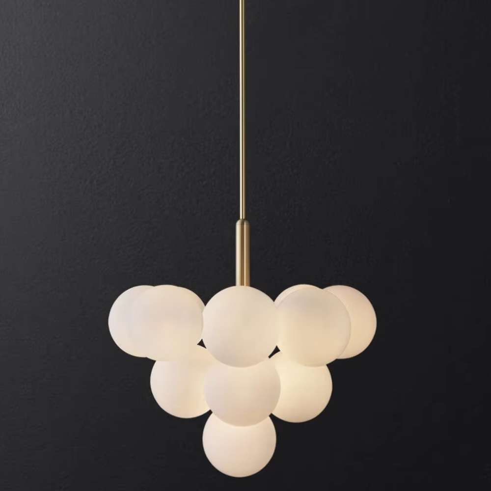 Modern light luxury gold magic bean chandelier, featuring a brass metal frame paired with clustered milk-white frosted glass balls. It emits soft and gentle light, combining warmth and style, making it a decorative lighting fixture that enhances the space's texture.