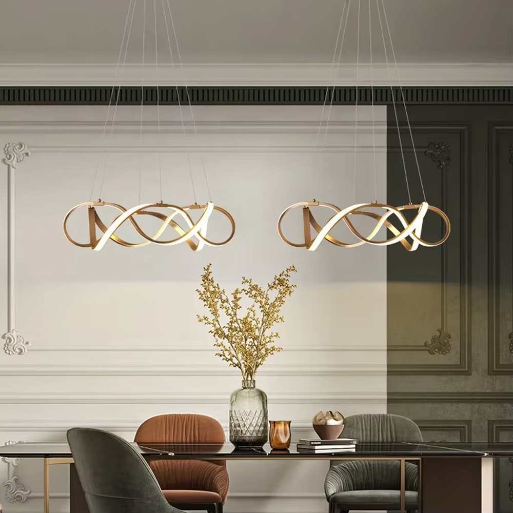 Modern art ribbon chandelier, featuring interwoven and flowing gold metal strips with built-in soft LED lighting. Its dynamic and layered lines combine artistry and ambiance, making it a high-end decorative lighting fixture that elevates the space's style.
