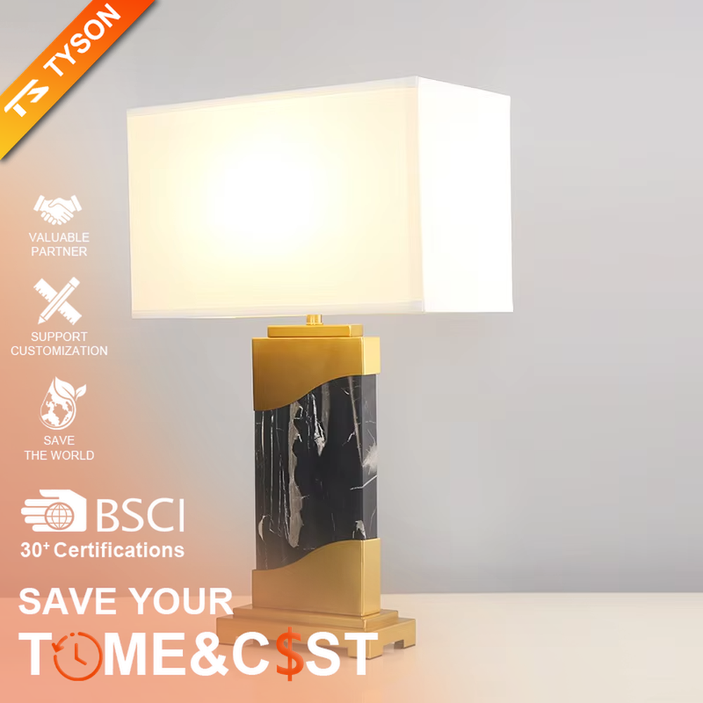 This is a luxury black-gold marble table lamp, with a golden metal frame, black-veined marble (with curved design), and a white fabric square lampshade, featuring a minimalist luxury design with high-quality texture. It is used for local desktop lighting and decoration, creating a high-end luxury atmosphere. It is suitable for luxury-style home bedroom bedside tables, high-end hotel guest rooms, modern soft decoration display spaces and other places.