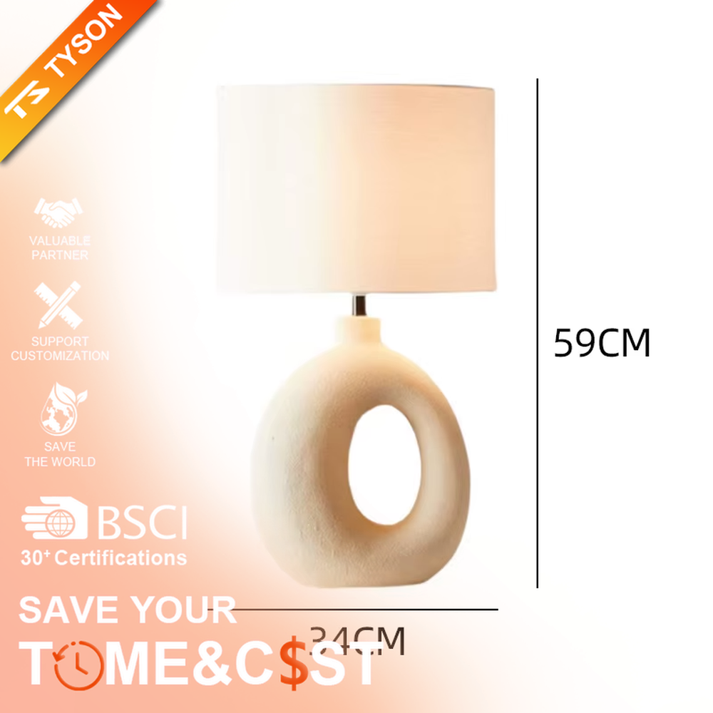 This is a modern artistic white hollow curved table lamp, with a white curved base (featuring a middle hollow design) paired with a white cylindrical lampshade. It has a minimalist artistic style and soft warm lighting.
