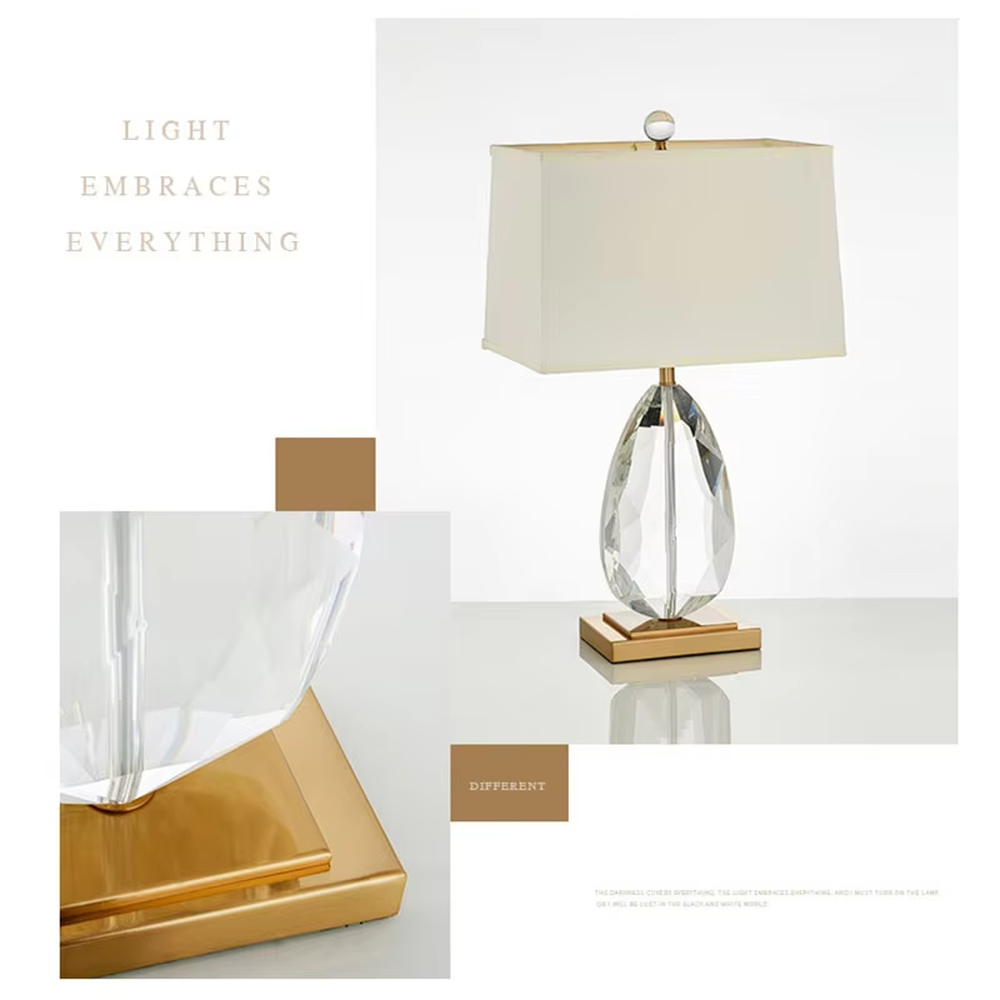 This is a light luxury exquisite water-drop shaped crystal table lamp, with a transparent cut water-drop crystal base paired with golden metal parts and a white square fabric lampshade. The design is simple and luxurious, with soft and elegant lighting. It is used for local desktop lighting and decoration, creating a light luxury exquisite atmosphere. Suitable for light luxury-style bedroom bedside tables, modern minimalist living room side tables, high-end hotel guest rooms and other places.