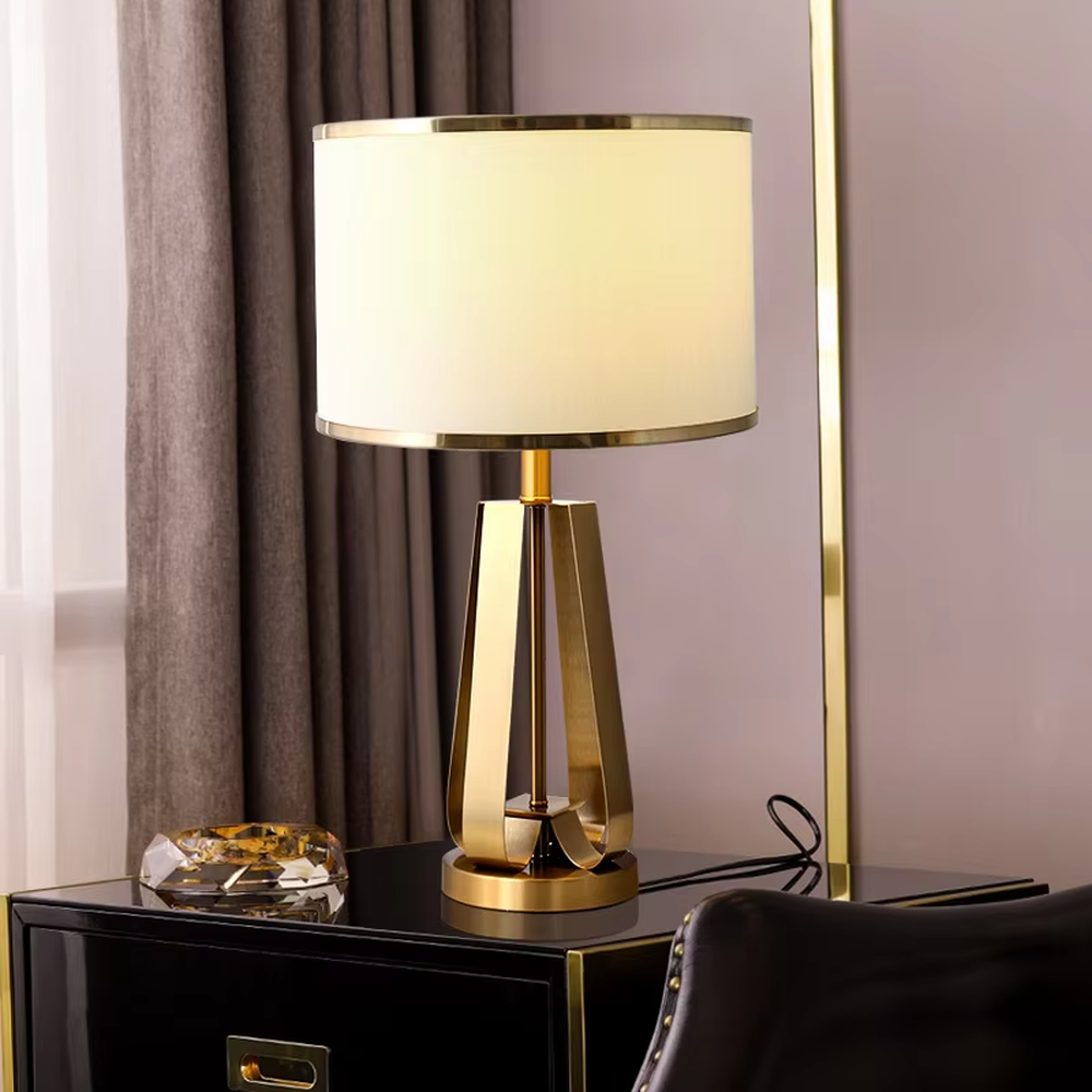 Light luxury golden geometric stand table lamp, beige fabric lampshade + golden decorative ring, soft lighting, creating a high-end elegant atmosphere.