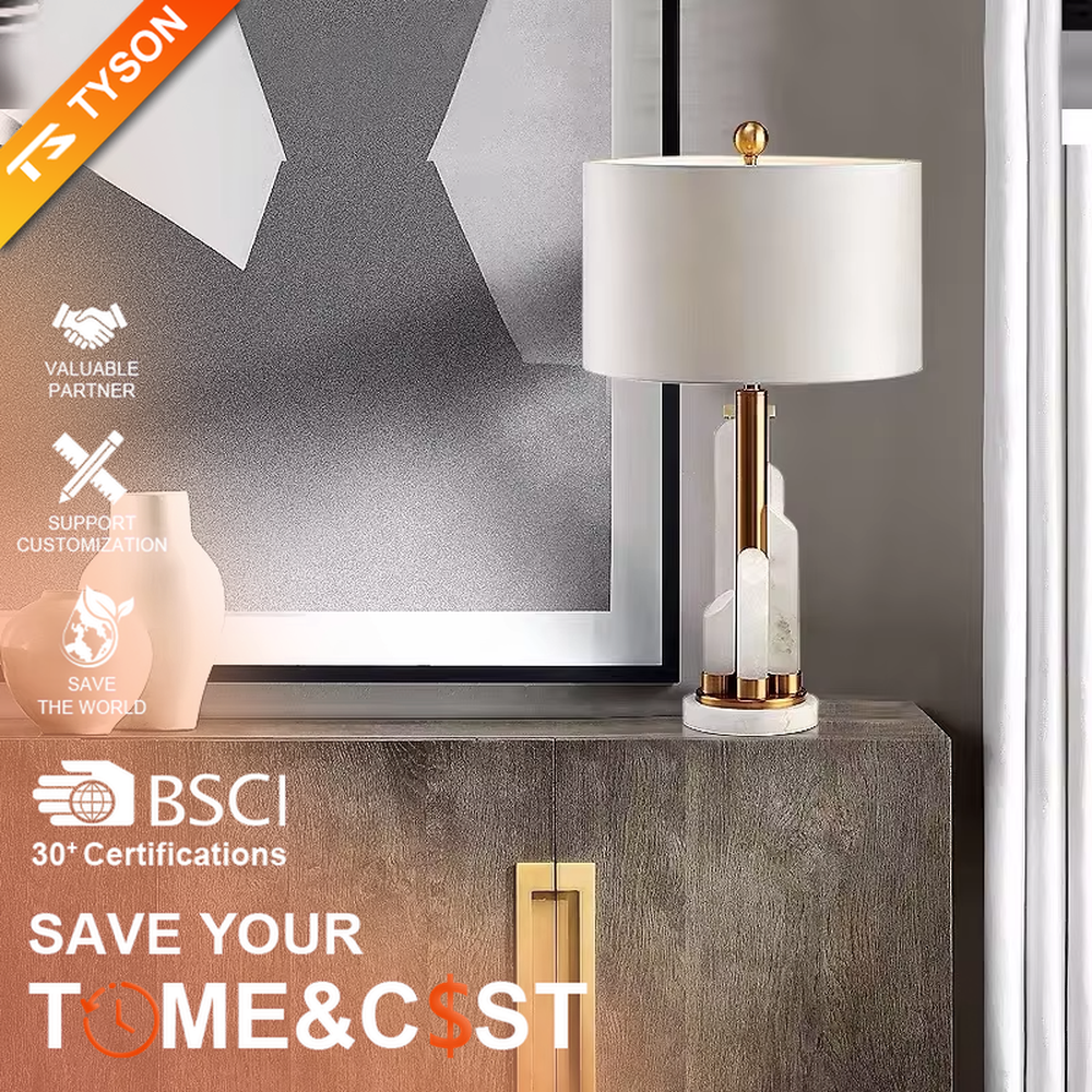 Light luxury white shade gold decorative marble base table lamp, white fabric lampshade + golden metal decorations + white marble base, soft lighting, creating a high-end elegant atmosphere.