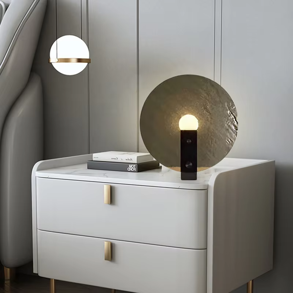 Modern artistic circular texture decorative table lamp, black base + spherical soft light shade, soft and warm lighting, creating a high-end minimalist atmosphere.