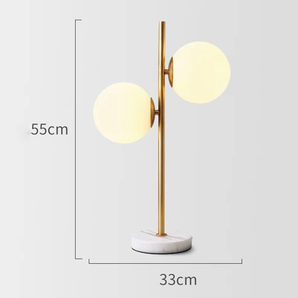 This is a modern light luxury double-ball table lamp, with a golden lamp pole paired with frosted white ball lampshades and a white marble base. The style is simple and exquisite, with soft and warm lighting.