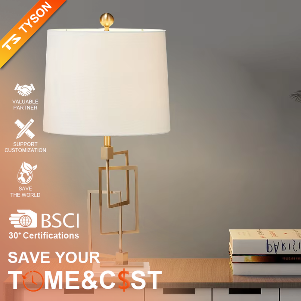 Light luxury modern geometric square frame gold stand table lamp, golden multi-layer square frame stand + beige fabric cylindrical lampshade + white stone base, soft and high-end lighting, creating a light luxury minimalist atmosphere.