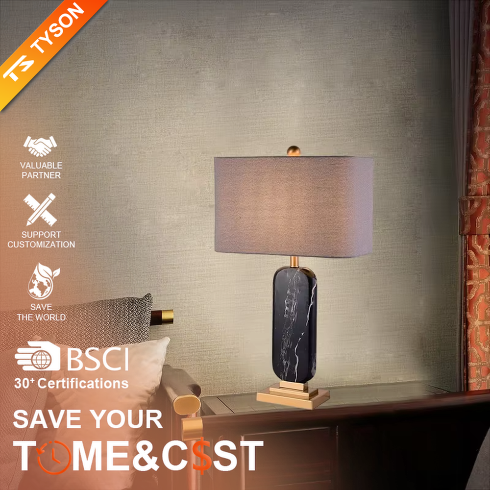 This is a luxury black-gold marble table lamp, with a black-veined marble base, golden metal components, and a gray fabric square lampshade, featuring a minimalist luxury design with high-quality texture. It is used for local desktop lighting and decoration, creating a high-end luxury atmosphere. It is suitable for luxury-style home bedroom bedside tables, high-end hotel guest rooms, modern soft decoration display spaces and other places.