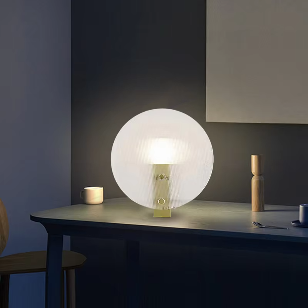 Modern artistic circular texture decorative table lamp, black base + spherical soft light shade, soft and warm lighting, creating a high-end minimalist atmosphere.