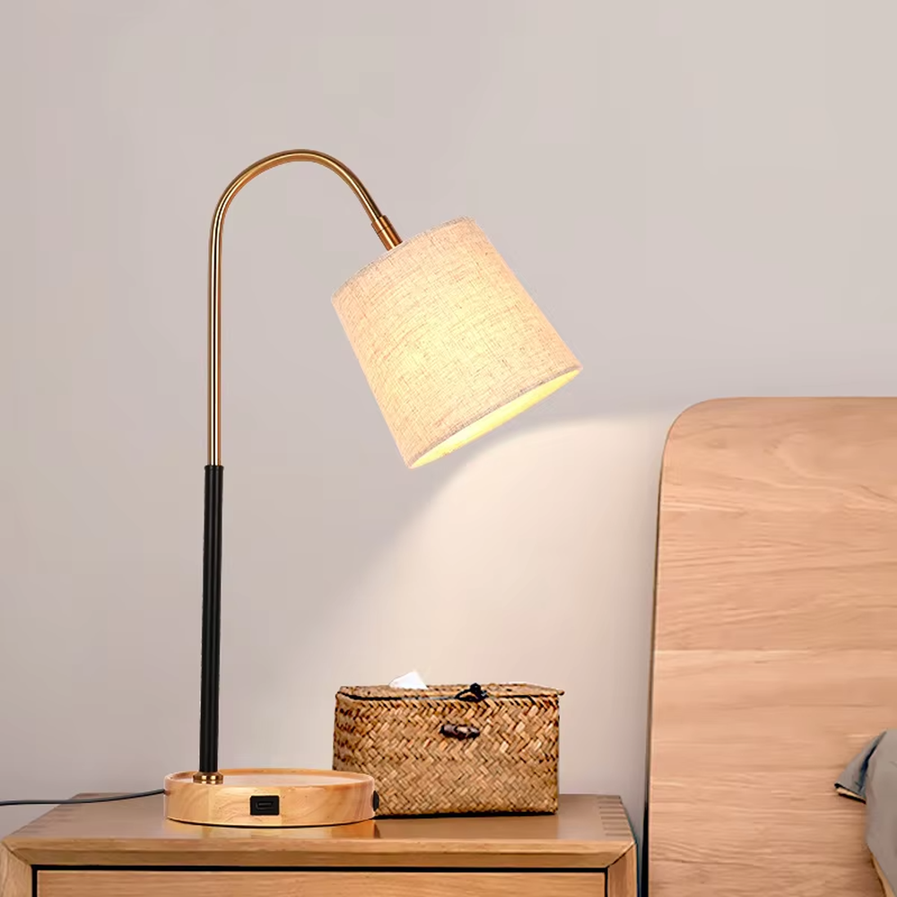 Light luxury natural-style golden curved lamp pole wooden base table lamp, linen fabric lampshade + black-gold decorative section, soft and warm lighting, creating a comfortable elegant atmosphere.