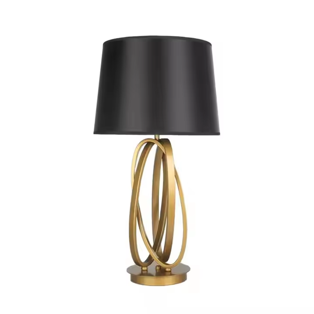 This is a modern luxury circular metal table lamp, with a golden interlaced circular metal base and a black fabric conical lampshade, featuring an artistic design and strong luxury texture. It is used for local desktop lighting and decoration, creating a high-end luxury atmosphere. It is suitable for luxury-style home bedroom bedside tables, modern minimalist living room side tables, high-end hotel guest rooms and other places.