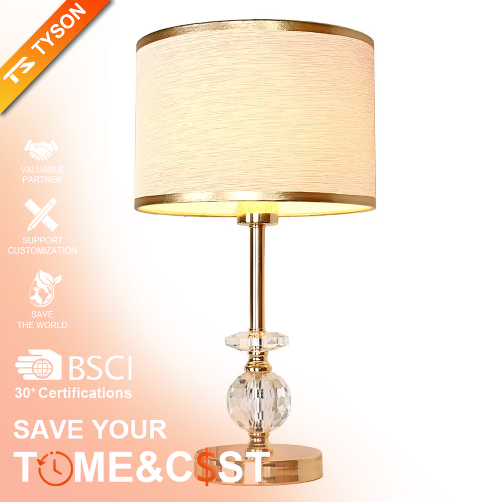 This is a light luxury exquisite fabric crystal table lamp, with a beige fabric lampshade paired with a golden trim, a golden metal lamp pole embedded with transparent cut crystal decorations, a high-quality golden base, and soft and elegant lighting, creating a light luxury exquisite atmosphere.