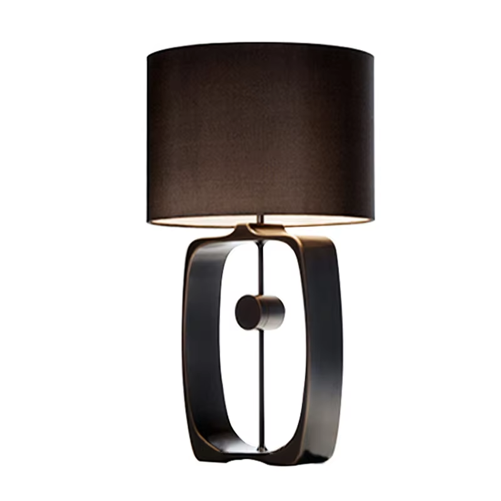 Modern minimalist black hollow frame table lamp, black fabric cylindrical lampshade + metal hollow rectangular base, soft and high-end lighting, creating a minimalist textured atmosphere.