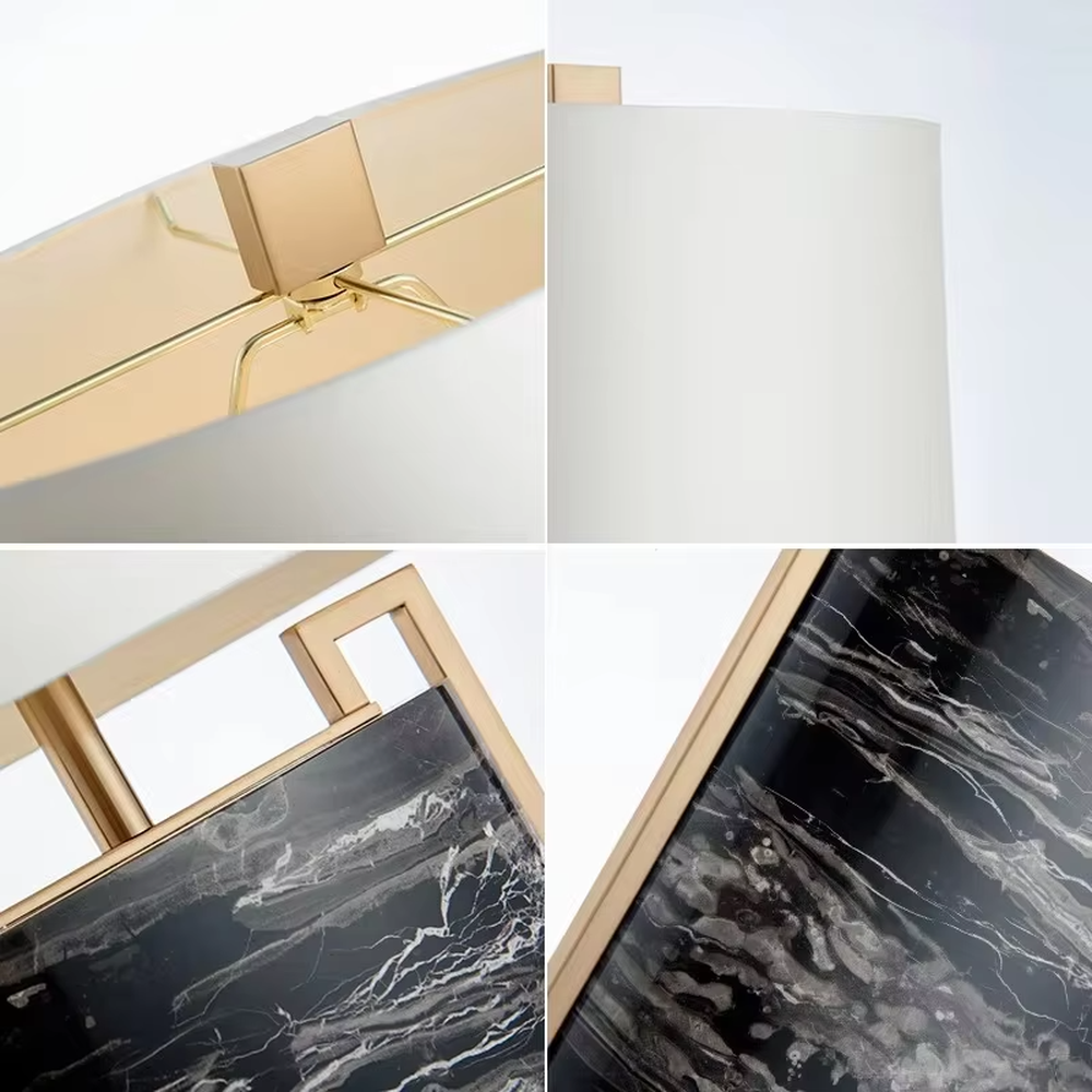 This is a luxury marble table lamp, with a black-veined marble base, a golden metal frame, and a white cylindrical fabric lampshade, featuring a minimalist luxury design with strong modern texture. It is used for local desktop lighting and decoration, creating a high-end luxury atmosphere. It is suitable for luxury-style home bedroom bedside tables, high-end hotel guest rooms, modern soft decoration display spaces and other places.
