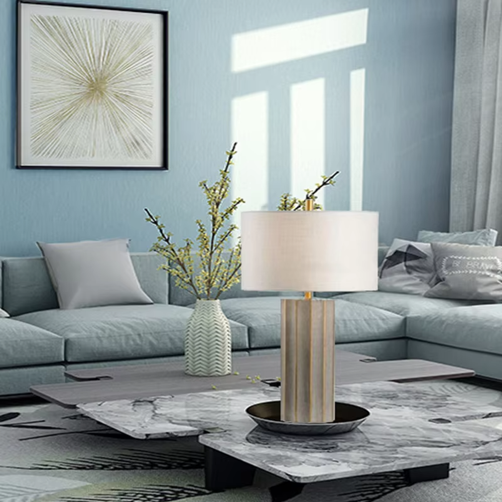 This is a luxury artistic agate-textured table lamp, with a golden metal frame inlaid with blue agate texture decoration and a white square fabric lampshade, featuring a minimalist and grand design with both artistic sense and luxury texture. It is used for local desktop lighting and decoration, creating a luxury artistic atmosphere. It is suitable for luxury-style home bedroom bedside tables, high-end hotel guest rooms, art exhibition hall display tables and other places.