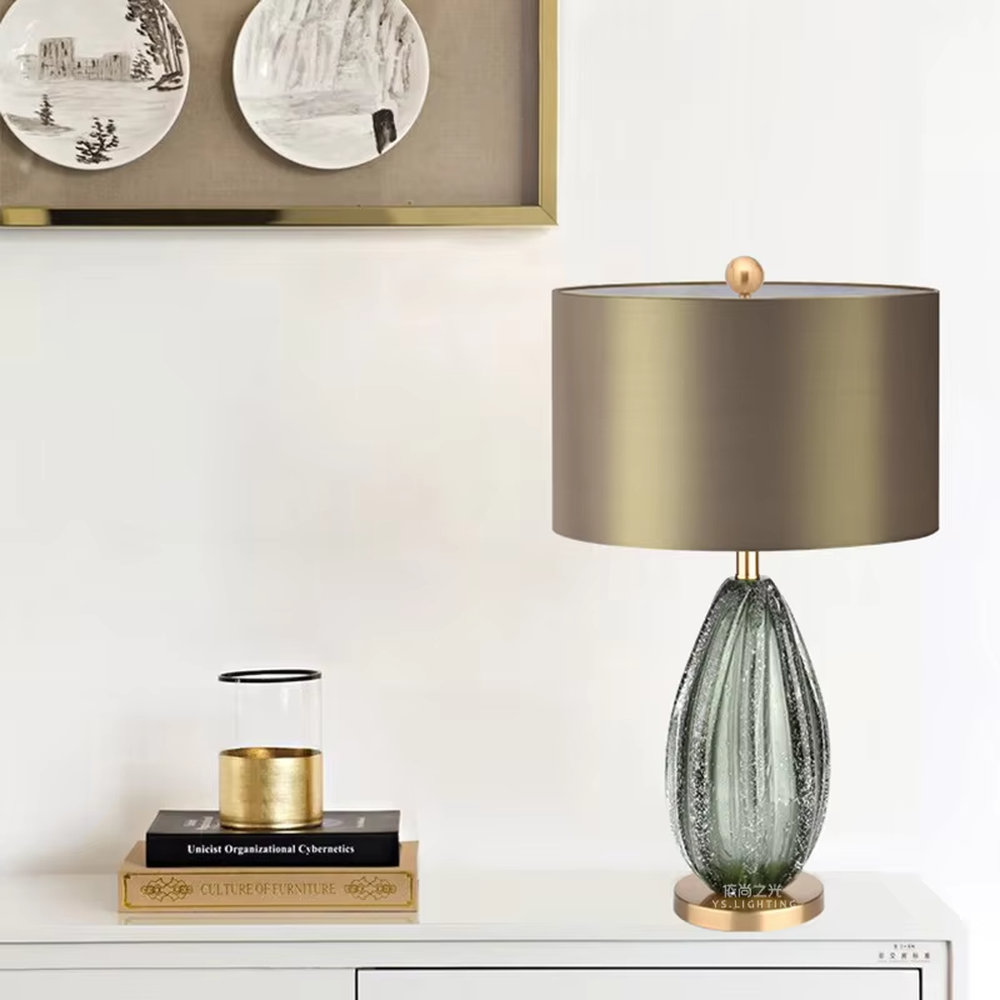 Light luxury dark brown fabric lampshade teardrop-textured table lamp, black-gray textured base + golden base, soft lighting, creating a high-end elegant atmosphere.