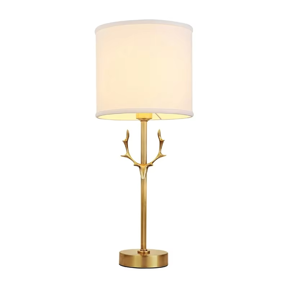 Light luxury golden antler-shaped table lamp, white cylindrical fabric lampshade + golden base, soft and warm lighting, creating a natural elegant atmosphere.