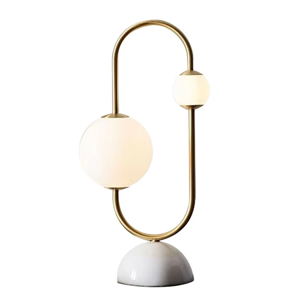 Modern light luxury U-shaped gold frame double-ball table lamp, white glass lampshades + white hemispherical base, soft lighting, creating a minimalist high-end atmosphere.