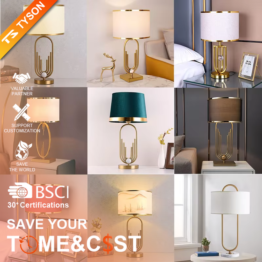 Light luxury golden geometric line base table lamp, beige fabric gold-edged lampshade + golden U-shaped multi-layer frame + white small ball decoration, soft warm light, creating a modern light luxury atmosphere.