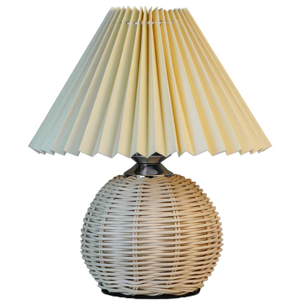 Natural minimalist rattan spherical table lamp, yellow pleated fabric lampshade paired with silver metal decorations, soft and warm lighting, creating a natural and comfortable space atmosphere.