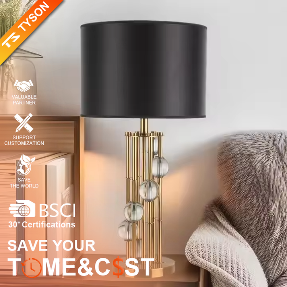 This is a luxury black-gold crystal table lamp, with a golden metal column (with multiple thin columns design) and transparent crystal balls, a black cylindrical fabric lampshade, featuring a modern luxury design with high-quality texture. It is used for local desktop lighting and decoration, creating a high-end luxury atmosphere. It is suitable for luxury-style home bedroom bedside tables, high-end hotel guest rooms, modern soft decoration display spaces and other places.