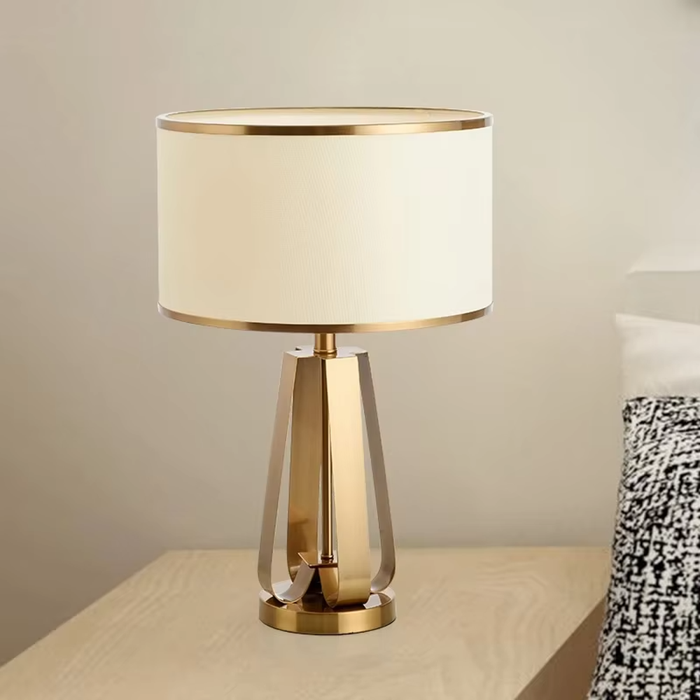 Light luxury golden geometric stand table lamp, beige fabric lampshade + golden decorative ring, soft lighting, creating a high-end elegant atmosphere.