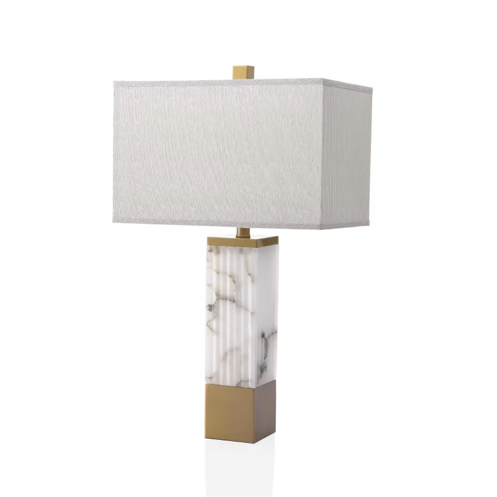 This is a luxury marble table lamp, with a white marble (textured) base, golden metal components, and a white fabric square lampshade, featuring a minimalist luxury design with high-quality texture. It is used for local desktop lighting and decoration, creating a high-end luxury atmosphere. It is suitable for luxury-style home bedroom bedside tables, high-end hotel guest rooms, modern soft decoration display spaces and other places.