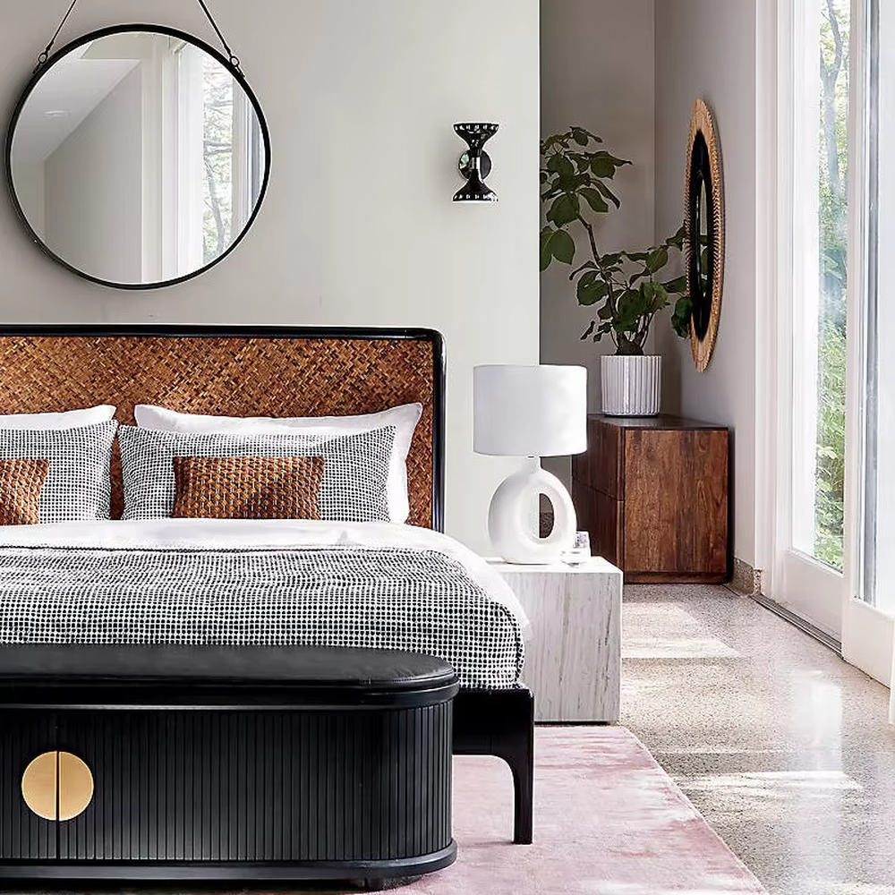 This is a modern artistic white hollow curved table lamp, with a white curved base (featuring a middle hollow design) paired with a white cylindrical lampshade. It has a minimalist artistic style and soft warm lighting.