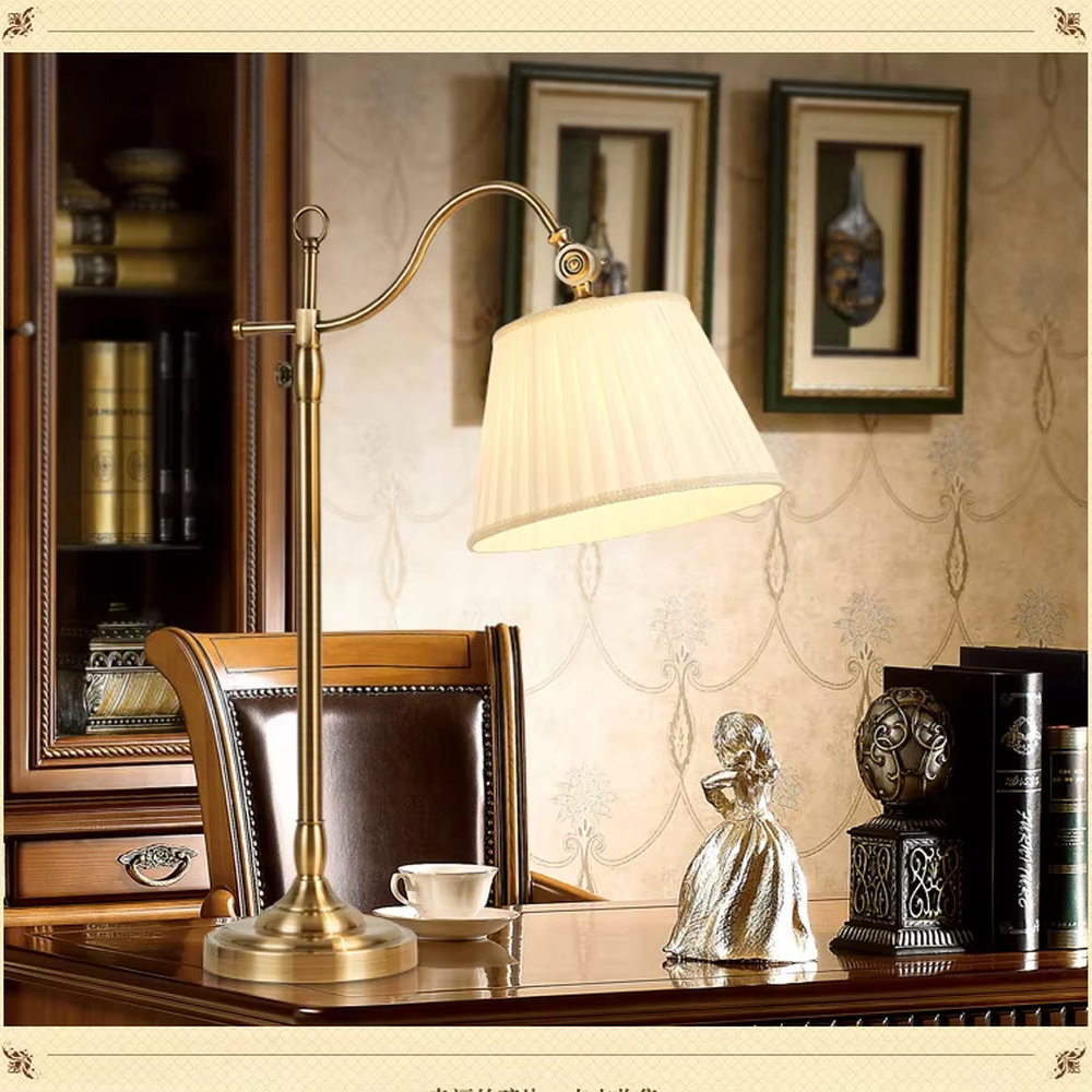 This is a retro European-style brass fabric table lamp, with a brass metal structure (with an adjustable curved arm and decorative details) and a beige pleated fabric lampshade. It features an exquisite retro design and soft warm lighting. It is used for local desktop lighting and decoration, creating a retro and warm atmosphere. Suitable for European-style bedrooms, studies, retro-style living rooms and other places.