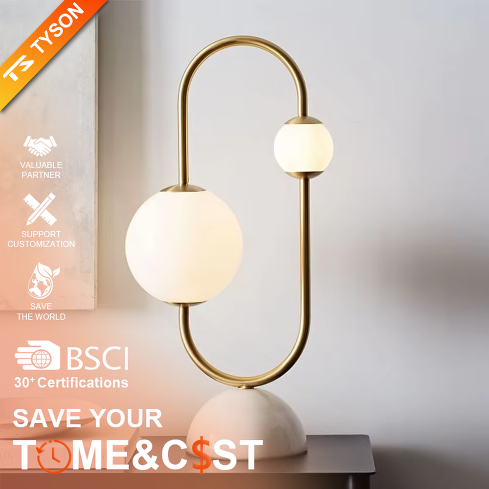 Modern light luxury U-shaped gold frame double-ball table lamp, white glass lampshades + white hemispherical base, soft lighting, creating a minimalist high-end atmosphere.